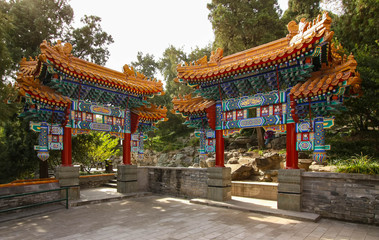 Naklejka premium Two very detail traditional Chinese decorative gates in the park, Beihai park, Beijing, China.