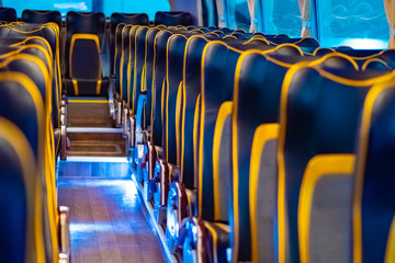 Seats on the bus. Premium bus. Organization of passenger transportation. Leather seats. Passenger transportation services. Concept - organization of logistics for conference delegates. © Grispb