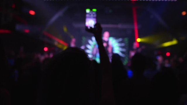 Woman making Video of Band Performance on Smartphone