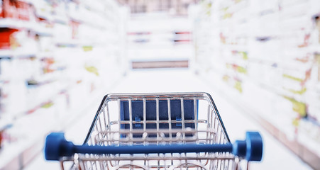 Background shopping trolley. Concept of shopping for groceries and things. Weekend shop.