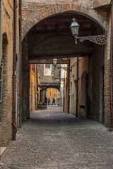 A walk in the old center of Ferrara, Italy