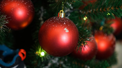 Christmas decorations on the Christmas tree. Red ball.