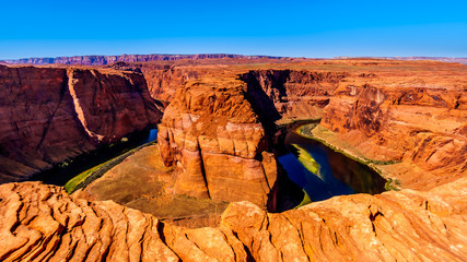 The famous Horseshoe Bend of the Colorado River in the semi desert landscape near Page, Arizona, United States