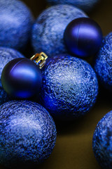 Close up Christmas balls classic blue texture. New Year wallpaper. Vertical orientation 