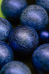 Close up Christmas balls classic blue texture. New Year wallpaper. Vertical orientation 