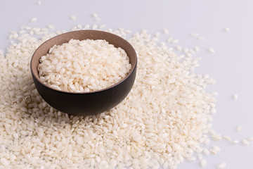 Italian Risotto rice on white background. Copy Space. Soft light. Latin term 