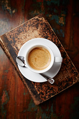Cup of coffee on rustic background. Top view. 
