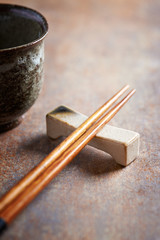 Wooden chopsticks and chopsticks rest. Close up.