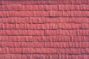 Red brick wall on a sunny day texture background. Beautiful concrete blocks. Close up