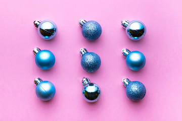 Xmas pattern. Christmas balls for decorations isolated on pink background. Flat lay. Abstract winter concept.