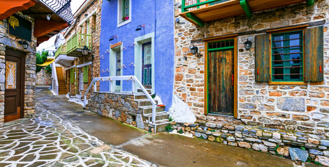 Fototapeta na wymiar Typical streets of old traditional villages of Greece - Alonissos island, Chora village. Sporades