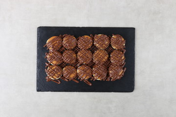 pancake with chocolate and pistachio on a texture background 