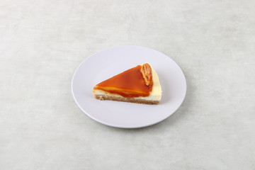 Caramel cheesecake with - cheese cake isolated on a wooden background 
