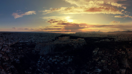 Aerial drone video of illuminated Acropolis hill and Masterpiece Parthenon with beautiful colours at dusk, Athens, Attica, Greece