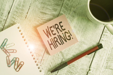 Writing note showing We Re Hiring. Business concept for recently employ someone or pay someone to...