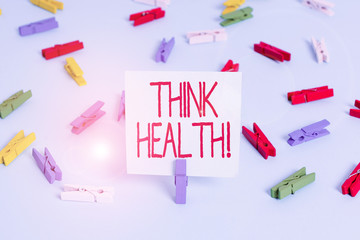 Writing note showing Think Health. Business concept for state of complete physical mental and social well being Colored clothespin papers empty reminder blue floor officepin