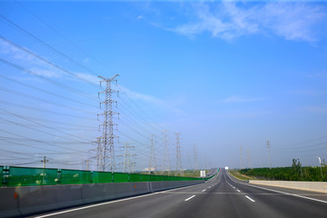Beautiful highway, under the blue sky and white clouds