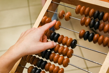 a girl&rsquo;s hands and old bills in hands