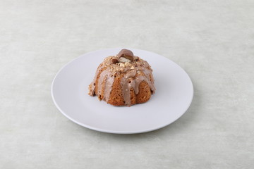 cake on a white plate on a texture background 