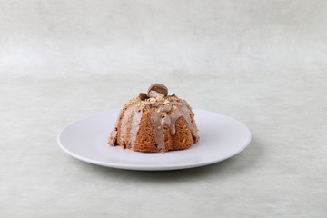 cake on a white plate on a texture background 