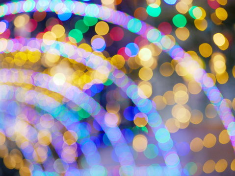 Bokeh background of colorful festive light turnel at night time