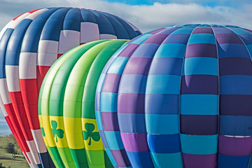 Obraz premium Close up of colorful hot air balloons ready to fly.