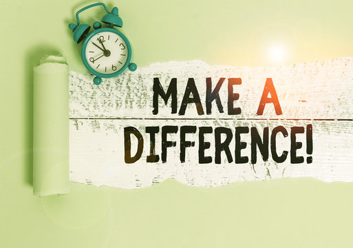 Writing note showing Make A Difference. Business concept for have significant effect or non on demonstrating or situation Alarm clock and torn cardboard on a wooden classic table backdrop