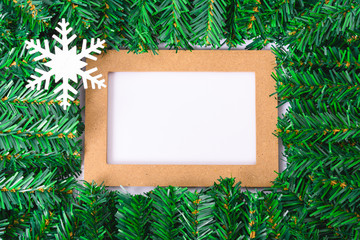 Happy New Year and Christmas day, top view flat lay composition decoration branches tree photo frame