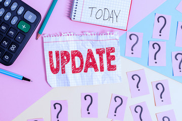 Conceptual hand writing showing Update. Concept meaning make something more modern or up to date like software program Mathematics stuff and writing equipment on pastel background