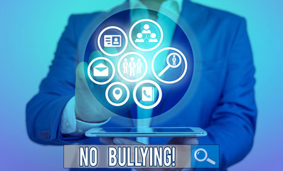 Conceptual hand writing showing No Bullying. Concept meaning stop aggressive behavior among...