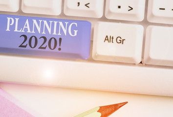 Conceptual hand writing showing Planning 2020. Concept meaning process of making plans for...