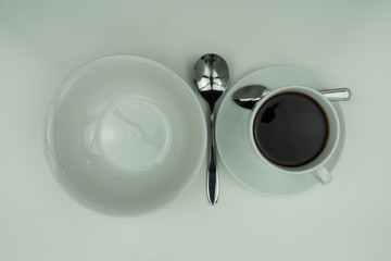 Obraz na płótnie Canvas White dishes, silver cutlery and coffee