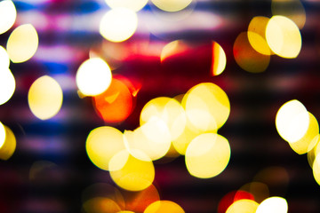 Beautiful soft focus bokeh balls with golden and red Christams tones.