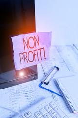Writing note showing Non Profit. Business concept for not making or conducted primarily to make...