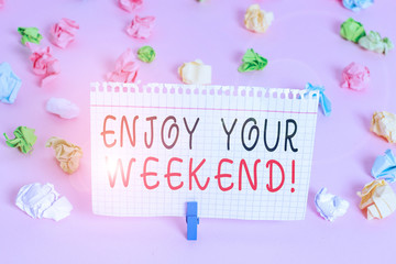 Writing note showing Enjoy Your Weekend. Business concept for wishing someone that something nice will happen at holiday Colored crumpled papers empty reminder pink floor background clothespin