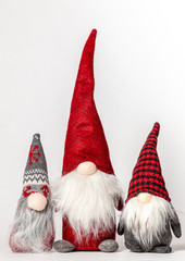 three gnomes on a white background 