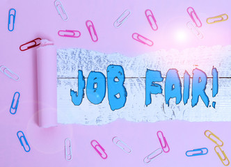 Conceptual hand writing showing Job Fair. Concept meaning event in which employers recruiters give information to employees Paper clip and torn cardboard on wood classic table backdrop