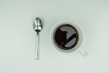 White dishes, silver cutlery and coffee