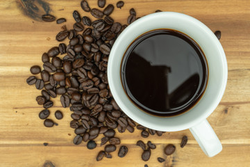 Hot coffee in a cup and coffee  beans