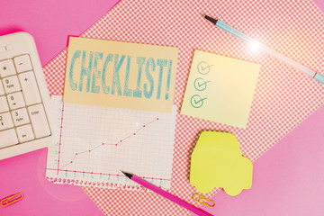 Handwriting text writing Checklist. Conceptual photo list items required things be done or points considered Writing equipments and computer stuffs placed above colored plain table