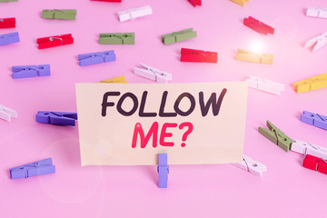 Conceptual hand writing showing Follow Me Question. Concept meaning go or come after demonstrating or thing proceeding ahead Colored clothespin papers empty reminder pink floor office