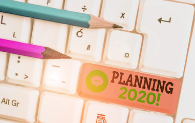 Writing note showing Planning 2020. Business concept for process of making plans for something next year