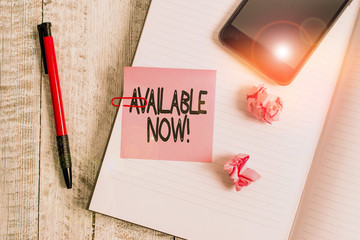 Text sign showing Available Now. Business photo text you can find it obtain or operable at this current moment Thick pages notebook stationary placed above classic look wooden backdrop