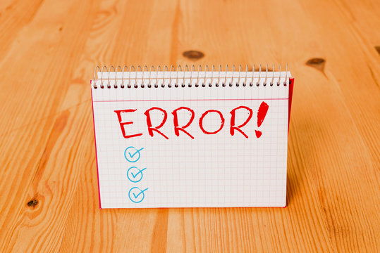 Handwriting text writing Error. Conceptual photo state or condition of being wrong in conduct judgement or program Empty reminder wooden floor background spiral notebook groove slot office