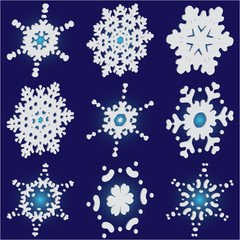 Set of christmas paper snowflakes on blue background.