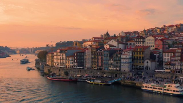 Porto, Portugal. Aerial view of the old city with promenade of the Douro river at sunset
