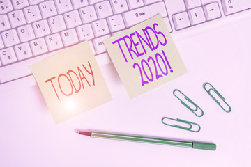 Word writing text Trends 2020. Business photo showcasing general direction in which something is developing or changing Square green note paper with pencil on the white background