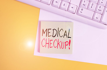 Word writing text Medical Checkup. Business photo showcasing thorough physical examination includes variety of tests Empty blank paper with copy space and pc keyboard above orange background table