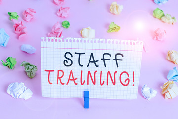 Writing note showing Staff Training. Business concept for learn specific knowledge improve perforanalysisce in current roles Colored crumpled papers empty reminder pink floor background clothespin