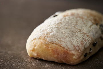 Olive bread, flour on surface 